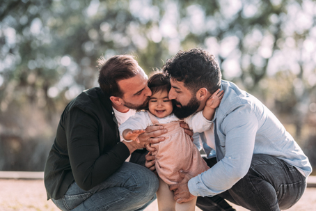 fathers kissing their daughter on the cheek