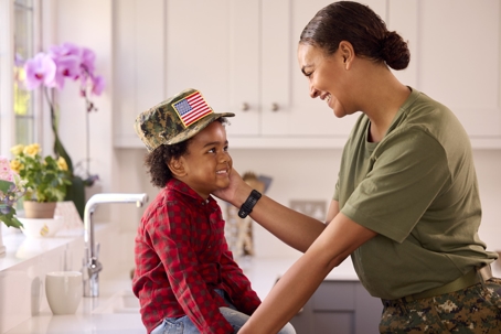 female servicemember spending time with son