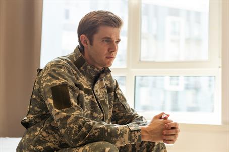 sad service member at home