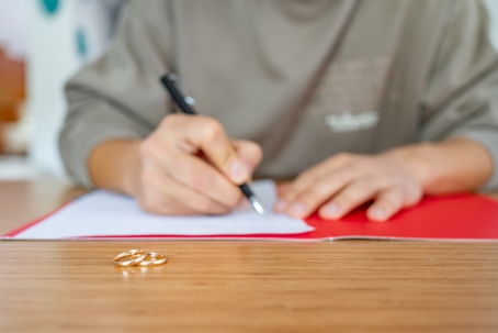 person signing divorce papers